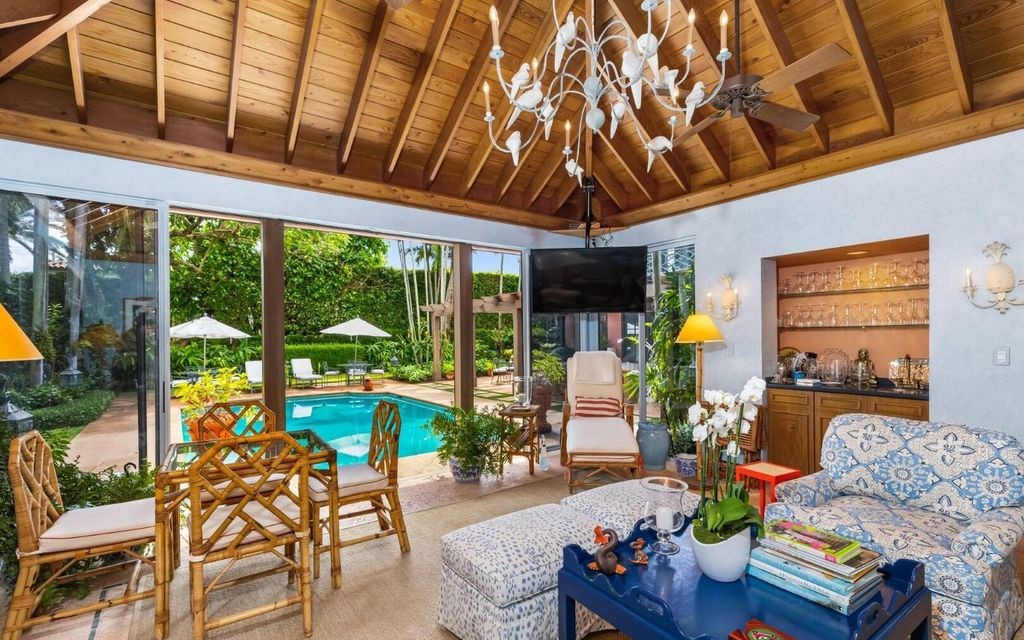 This exceptional 6BR/6.3BA Monterey-Style estate by Howard Major is a rare find on Palm Beach's exclusive El Bravo Way.