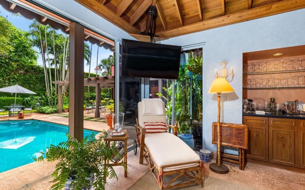 This exceptional 6BR/6.3BA Monterey-Style estate by Howard Major is a rare find on Palm Beach's exclusive El Bravo Way.
