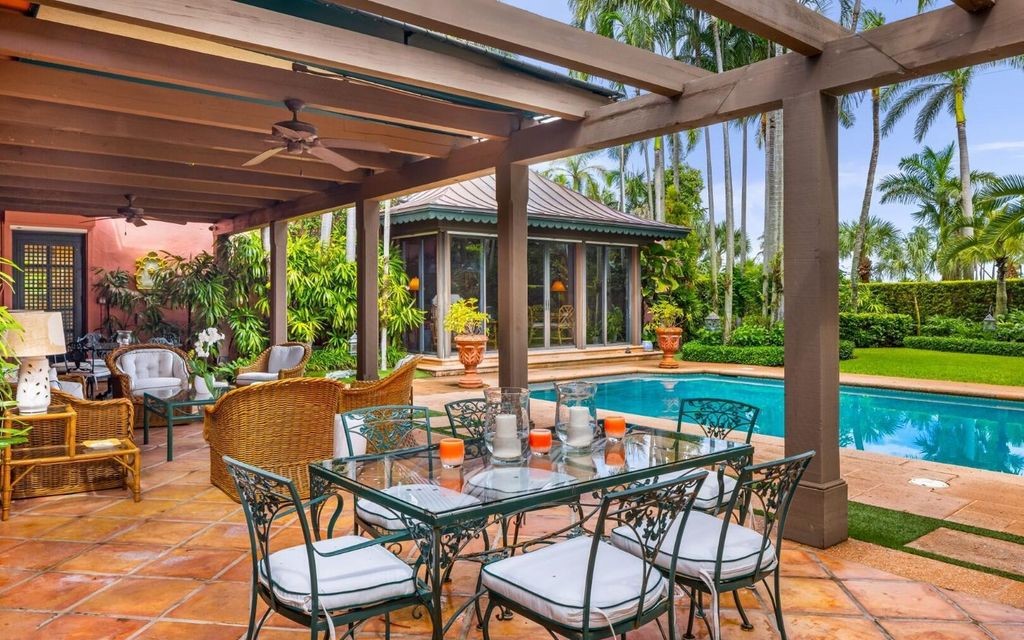 This exceptional 6BR/6.3BA Monterey-Style estate by Howard Major is a rare find on Palm Beach's exclusive El Bravo Way.