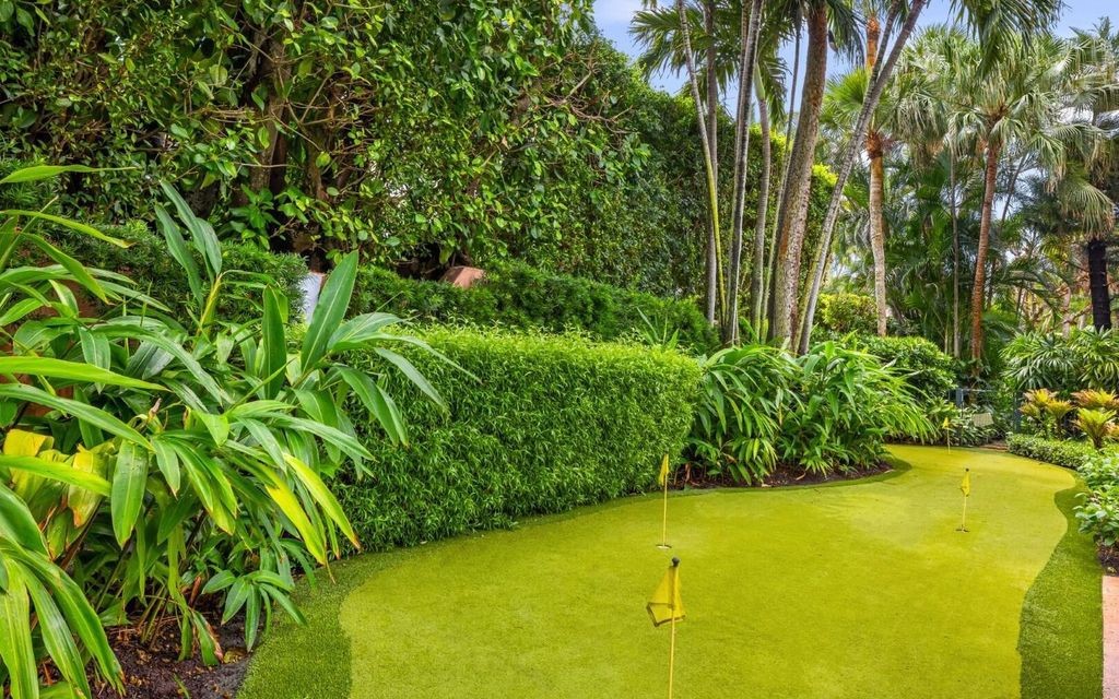 This exceptional 6BR/6.3BA Monterey-Style estate by Howard Major is a rare find on Palm Beach's exclusive El Bravo Way.