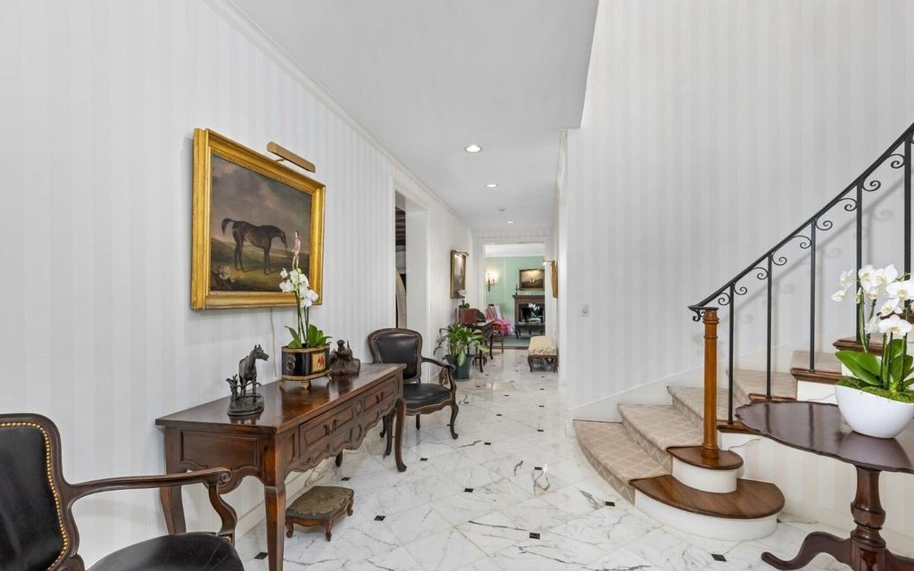 This exceptional 6BR/6.3BA Monterey-Style estate by Howard Major is a rare find on Palm Beach's exclusive El Bravo Way.