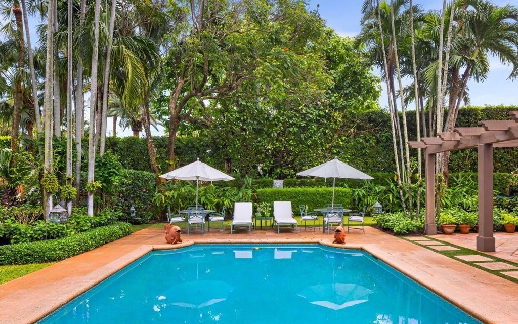 This exceptional 6BR/6.3BA Monterey-Style estate by Howard Major is a rare find on Palm Beach's exclusive El Bravo Way.