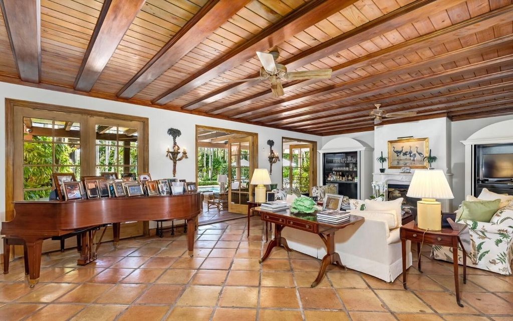 This exceptional 6BR/6.3BA Monterey-Style estate by Howard Major is a rare find on Palm Beach's exclusive El Bravo Way.