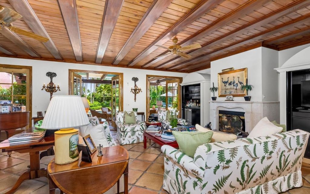 This exceptional 6BR/6.3BA Monterey-Style estate by Howard Major is a rare find on Palm Beach's exclusive El Bravo Way.