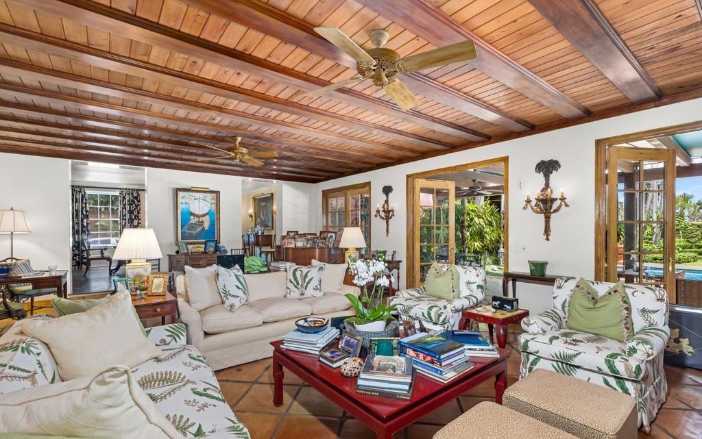 This exceptional 6BR/6.3BA Monterey-Style estate by Howard Major is a rare find on Palm Beach's exclusive El Bravo Way.