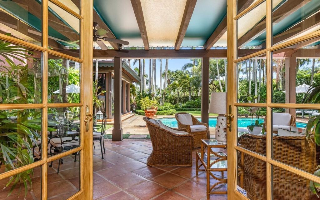 This exceptional 6BR/6.3BA Monterey-Style estate by Howard Major is a rare find on Palm Beach's exclusive El Bravo Way.