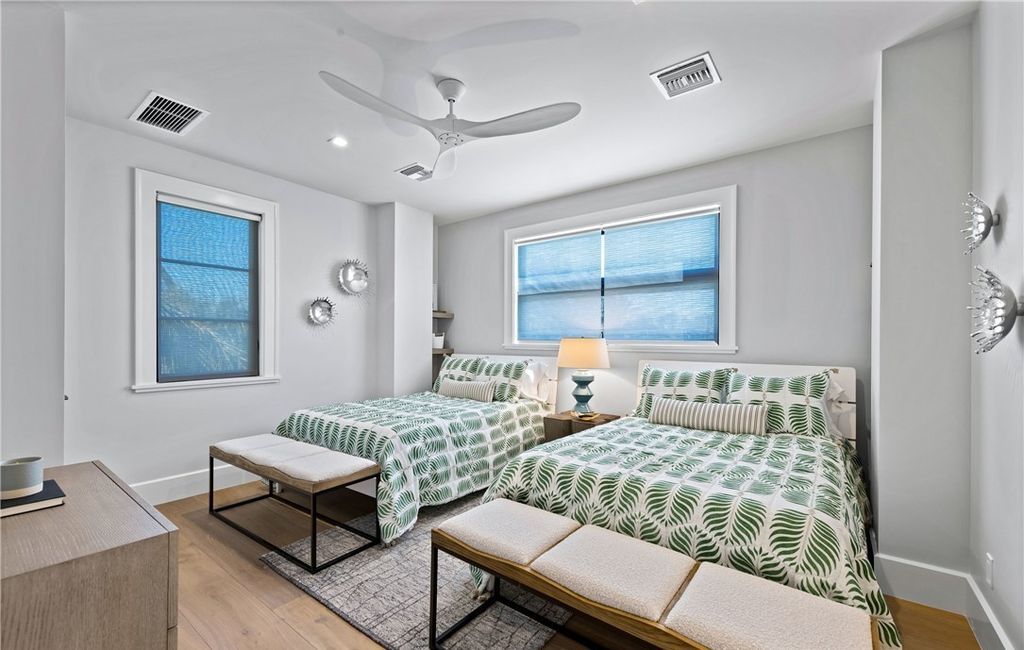 Spanning 8,596 square feet on nearly 1 acre, this 6-bedroom, 7-bathroom home blends resilient concrete and steel construction with sophisticated luxury.