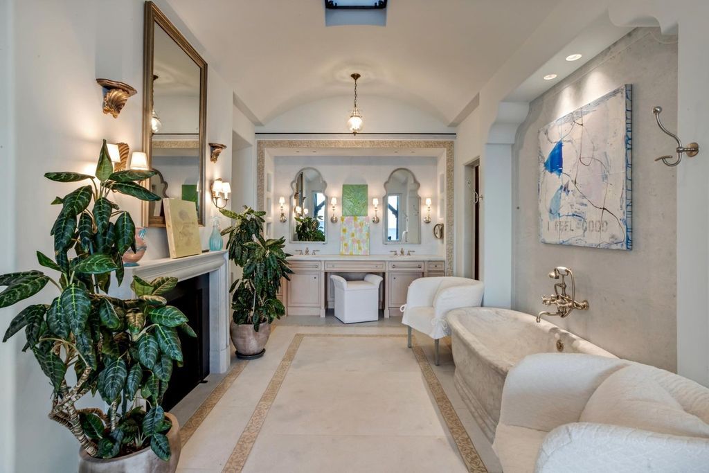 This stunning 8-bedroom, 9-bathroom estate spans 9,855 square feet and evokes the charm of Lake Como’s iconic villas. Designed by John Saladino, it blends rustic sophistication with grand elegance, featuring hand-hewn wood beams, reclaimed terra cotta floors, plaster walls, and a Tejas Borja tile roof.