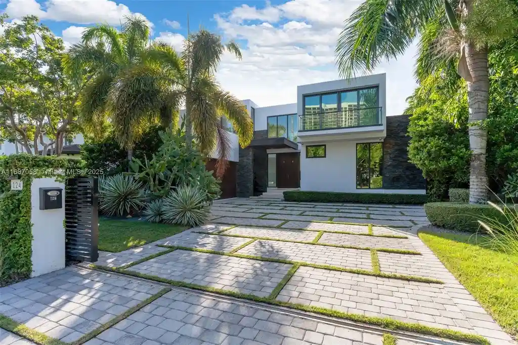Spacious living area at 124 Park Dr, Bal Harbour, with floor-to-ceiling windows and an elegant open layout.
