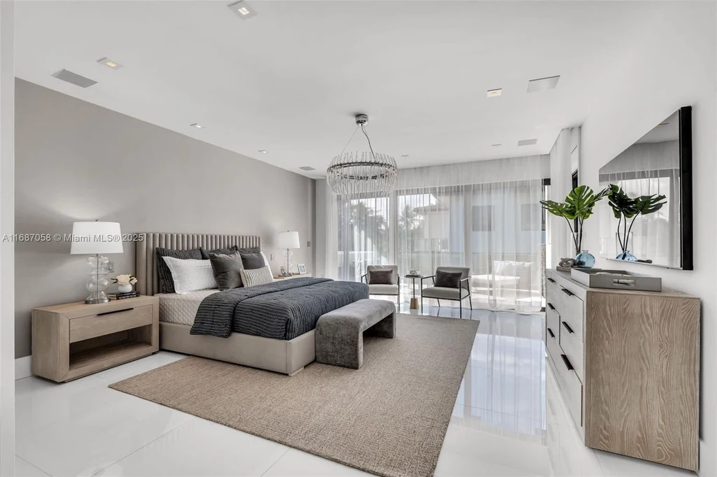 Spacious living area at 124 Park Dr, Bal Harbour, with floor-to-ceiling windows and an elegant open layout.