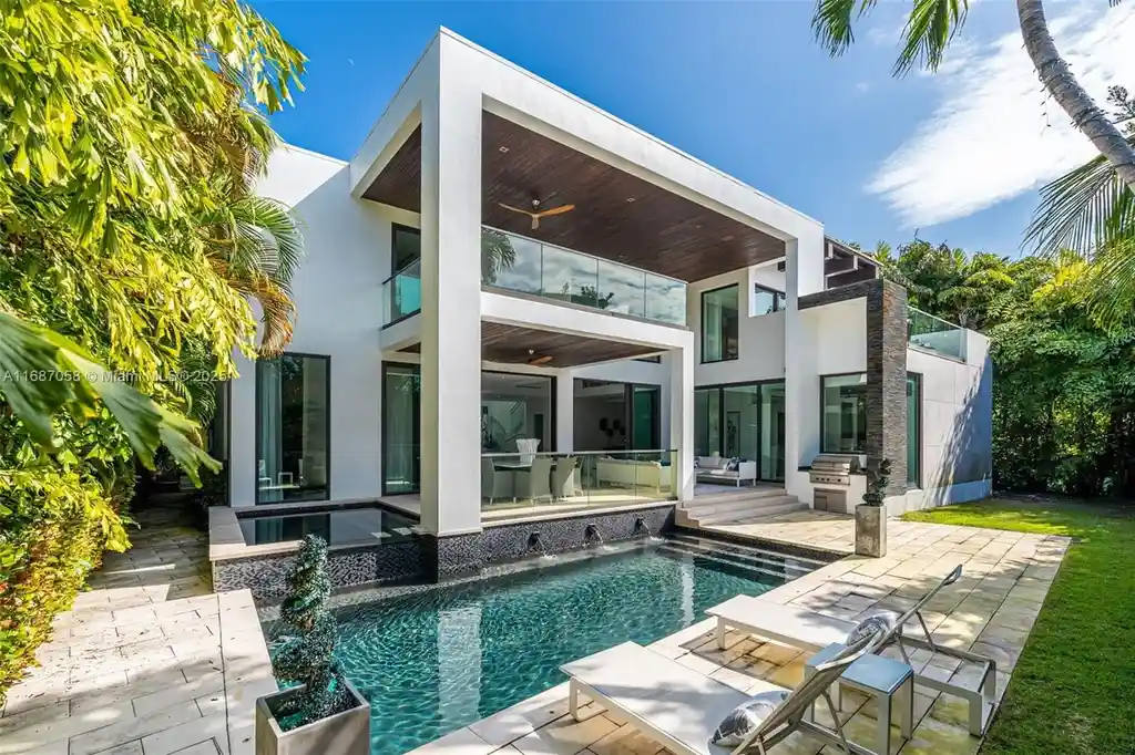 Spacious living area at 124 Park Dr, Bal Harbour, with floor-to-ceiling windows and an elegant open layout.