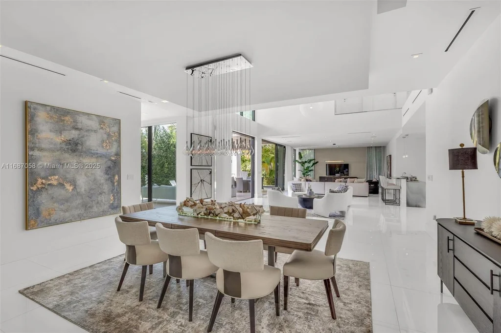 Spacious living area at 124 Park Dr, Bal Harbour, with floor-to-ceiling windows and an elegant open layout.