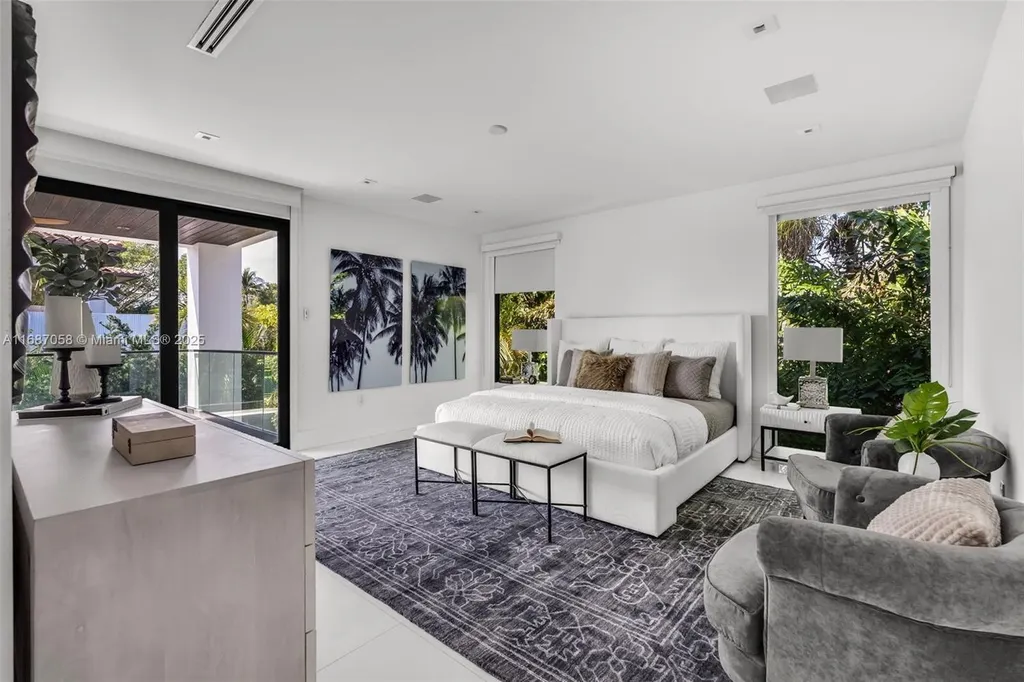 Spacious living area at 124 Park Dr, Bal Harbour, with floor-to-ceiling windows and an elegant open layout.