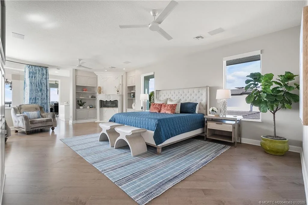 Luxurious waterfront estate in Sewalls Point featuring panoramic water views, resort-style pool, private boat lifts, and elegant architectural design. Perfect Sewalls Pt home for sale with 6 bedrooms, 7 baths, and modern amenities.