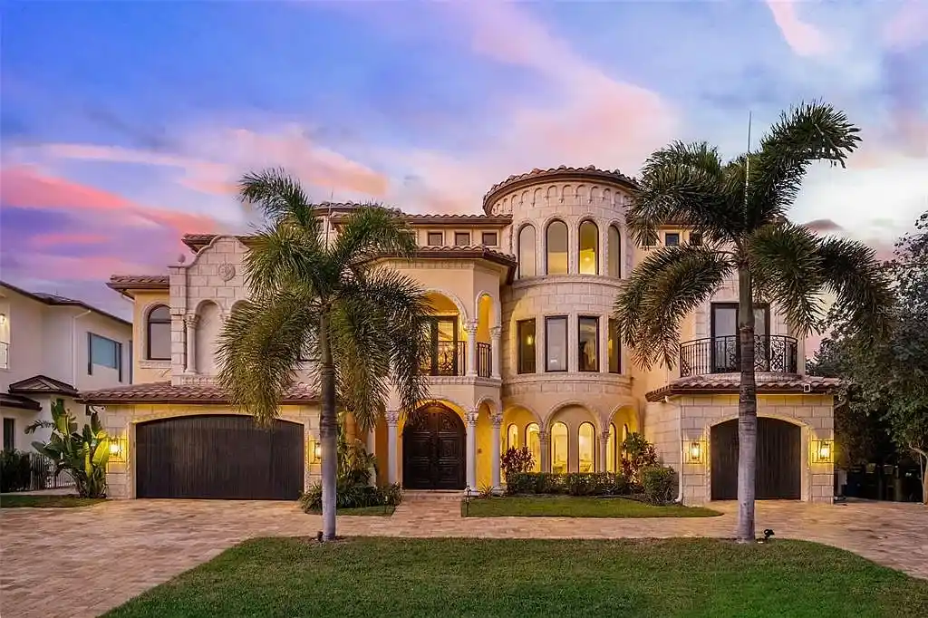 Luxury Mediterranean-style waterfront home at 1011 Rhodes Villa Ave, Delray Beach, featuring stunning architecture and direct Intracoastal Waterway access.
