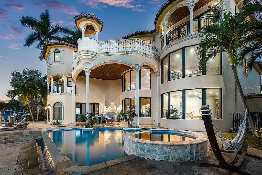 Luxury Mediterranean-style waterfront home at 1011 Rhodes Villa Ave, Delray Beach, featuring stunning architecture and direct Intracoastal Waterway access.