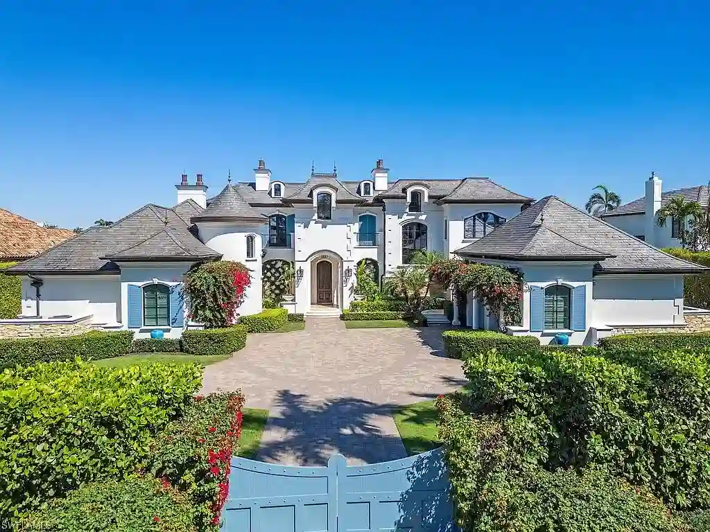Front exterior view of 3565 Fort Charles Dr, a stunning waterfront Naples home for sale in Port Royal