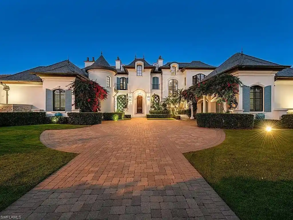 Front exterior view of 3565 Fort Charles Dr, a stunning waterfront Naples home for sale in Port Royal
