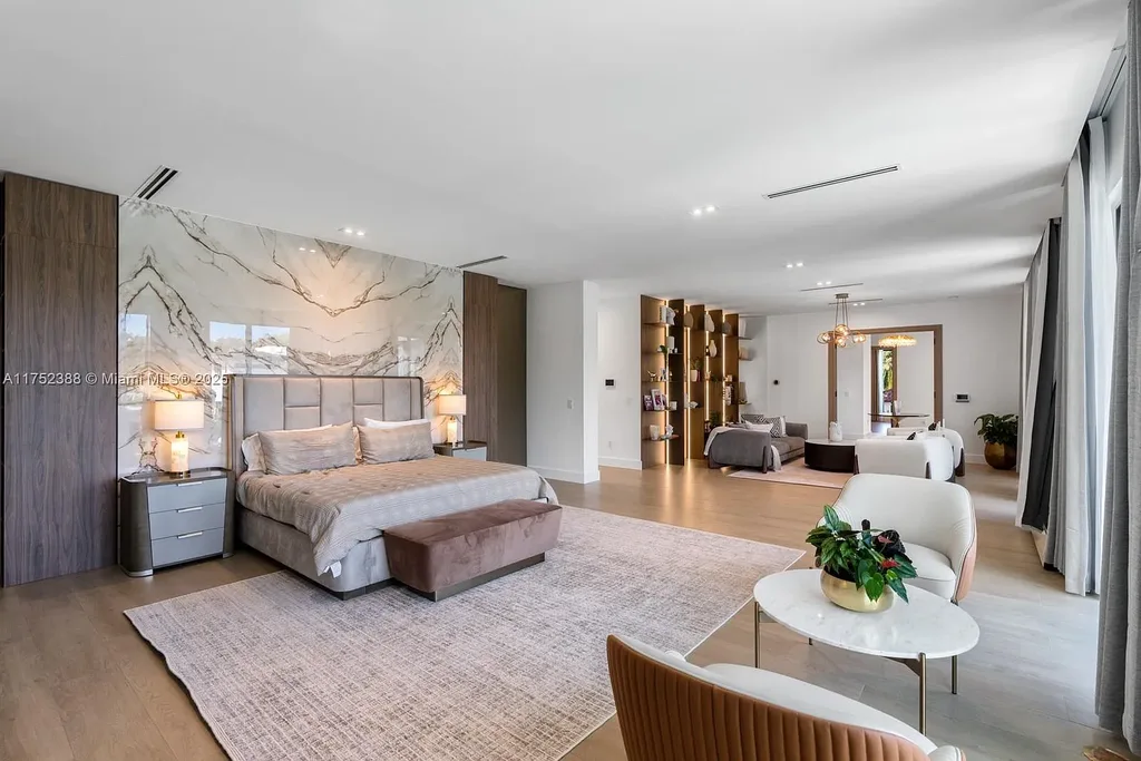 Luxury modern estate at 5900 SW 129th Terrace, Pinecrest, FL – a $17.99M newly built home featuring a pristine pool, private gym, immersive theater, and elegant open kitchen.