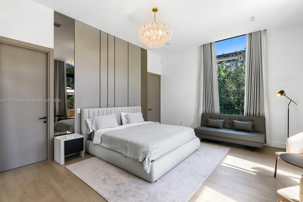 Luxury modern estate at 5900 SW 129th Terrace, Pinecrest, FL – a $17.99M newly built home featuring a pristine pool, private gym, immersive theater, and elegant open kitchen.