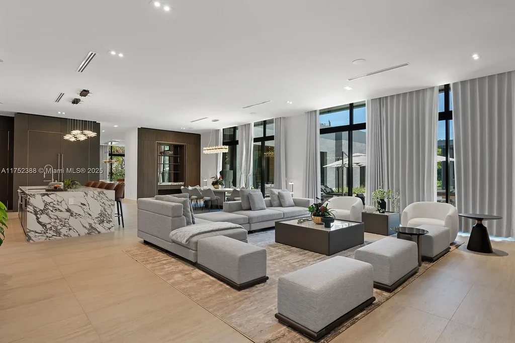 Luxury modern estate at 5900 SW 129th Terrace, Pinecrest, FL – a $17.99M newly built home featuring a pristine pool, private gym, immersive theater, and elegant open kitchen.