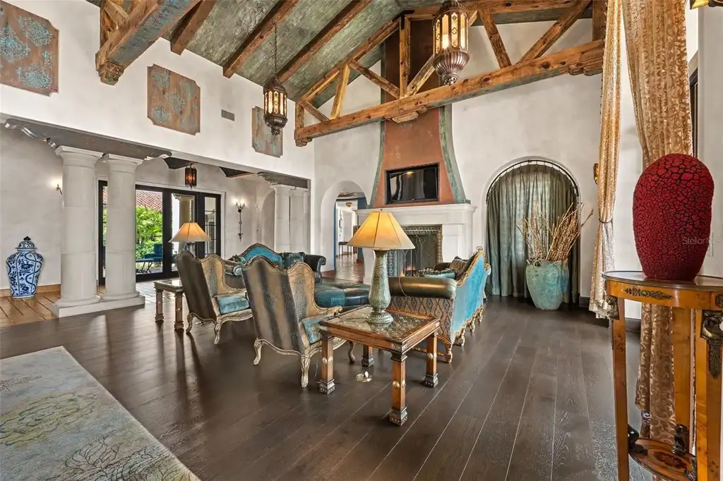 Luxury lakefront estate at 11865 Fort King Hwy in Thonotosassa, Florida, featuring Mediterranean architecture, private dock, Oval Office replica, and tiered pool.