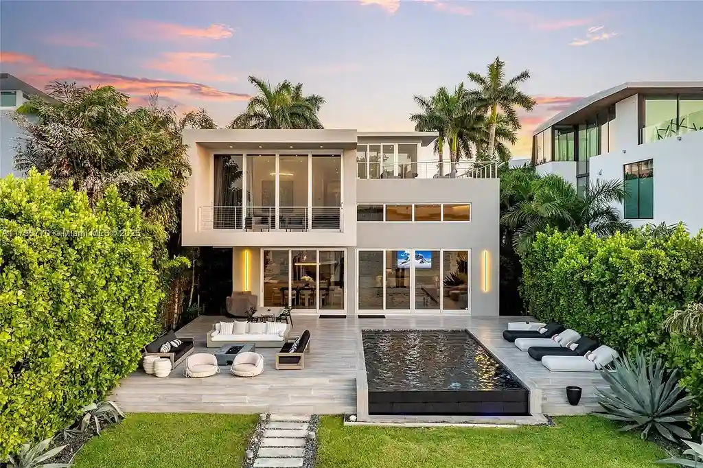 Modern open-concept living room in Miami Beach home for sale with custom stone finishes