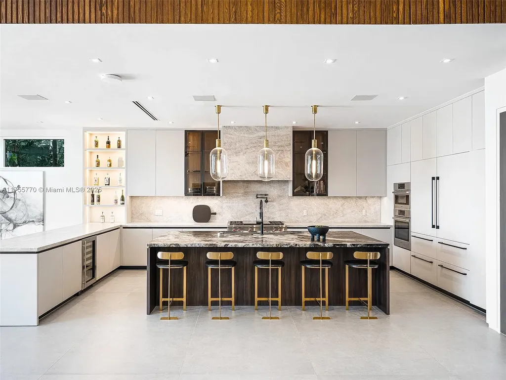 Modern open-concept living room in Miami Beach home for sale with custom stone finishes