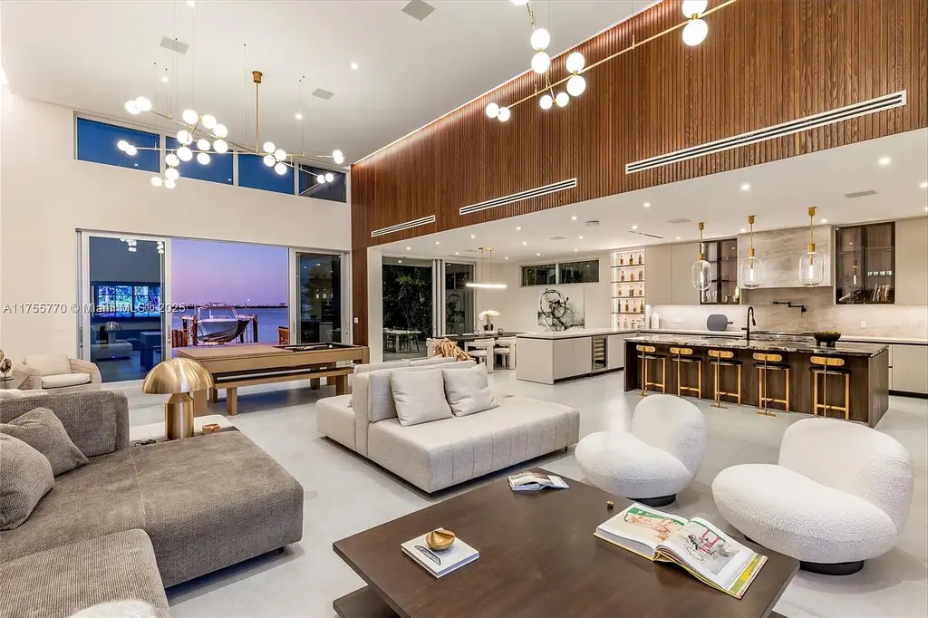 Modern open-concept living room in Miami Beach home for sale with custom stone finishes