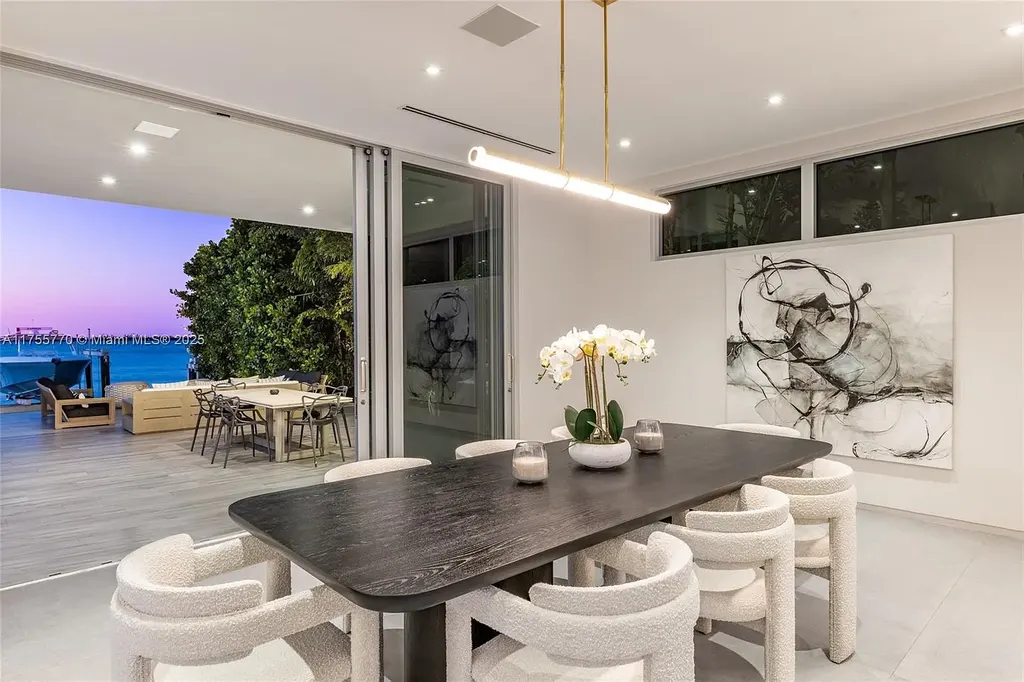 Modern open-concept living room in Miami Beach home for sale with custom stone finishes