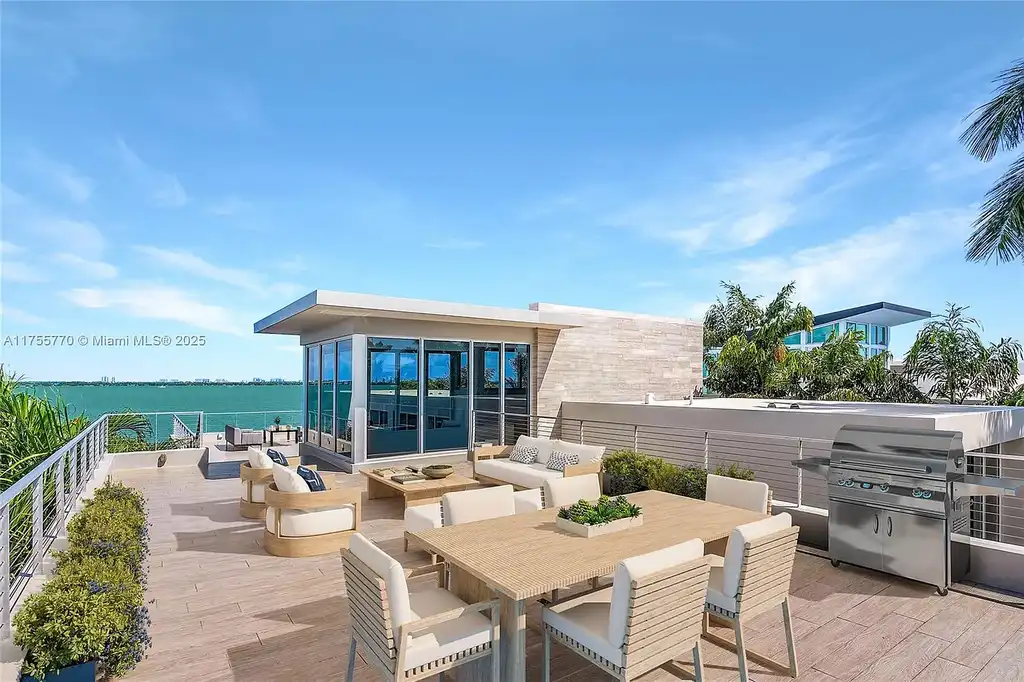 Modern open-concept living room in Miami Beach home for sale with custom stone finishes