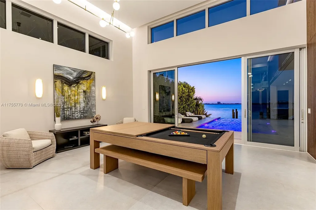 Modern open-concept living room in Miami Beach home for sale with custom stone finishes
