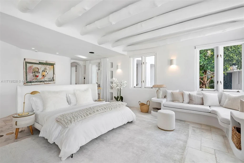 Luxury waterfront villa at 24 S Hibiscus Dr in Miami Beach with rooftop terraces, over-water dock, and two-level pool