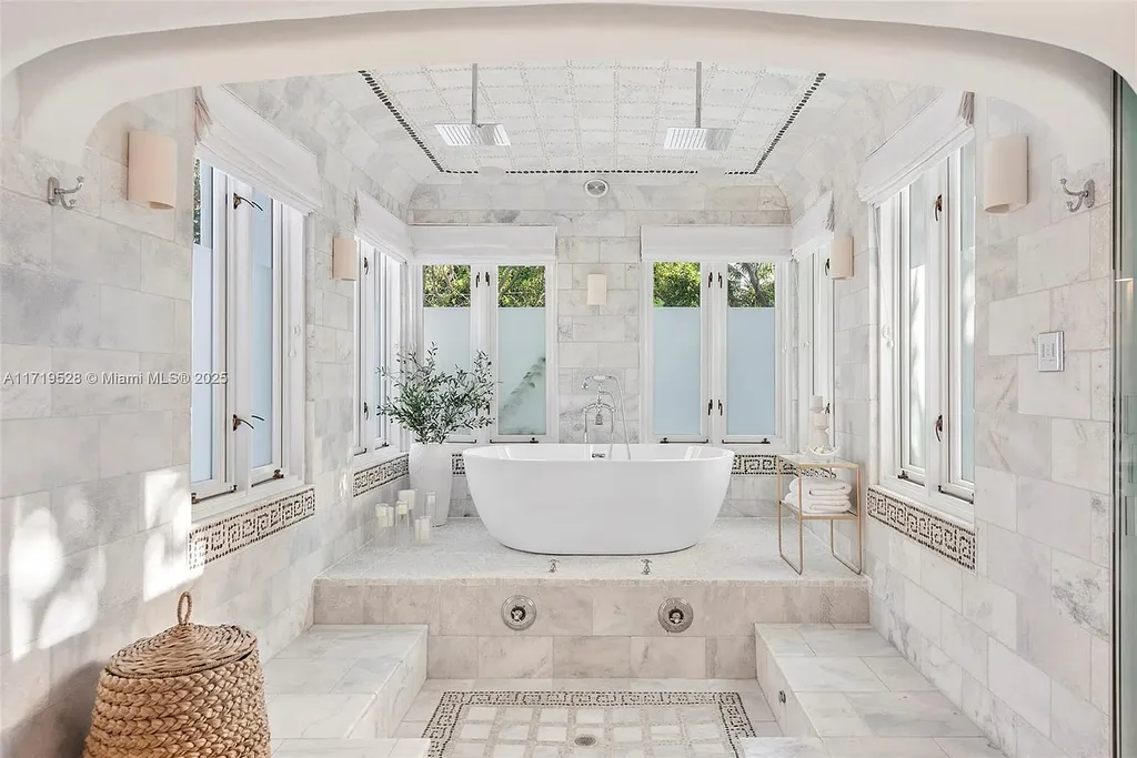 Luxury waterfront villa at 24 S Hibiscus Dr in Miami Beach with rooftop terraces, over-water dock, and two-level pool