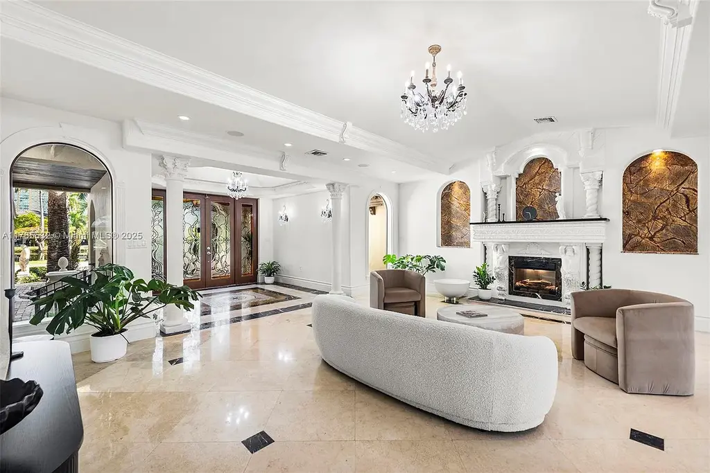 Gourmet kitchen in 270 Atlantic Ave Sunny Isles Beach home with Australian green marble floors and premium appliances