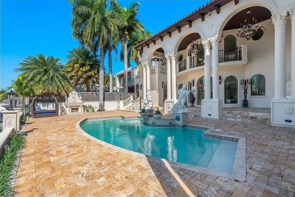 Gourmet kitchen in 270 Atlantic Ave Sunny Isles Beach home with Australian green marble floors and premium appliances