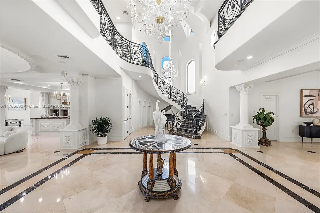 Gourmet kitchen in 270 Atlantic Ave Sunny Isles Beach home with Australian green marble floors and premium appliances