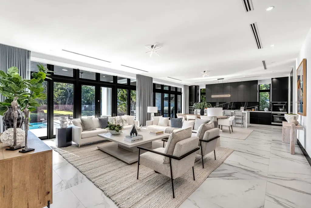 Infinity-edge pool and backyard oasis with canal views at 4424 Granada Blvd Coral Gables home for sale