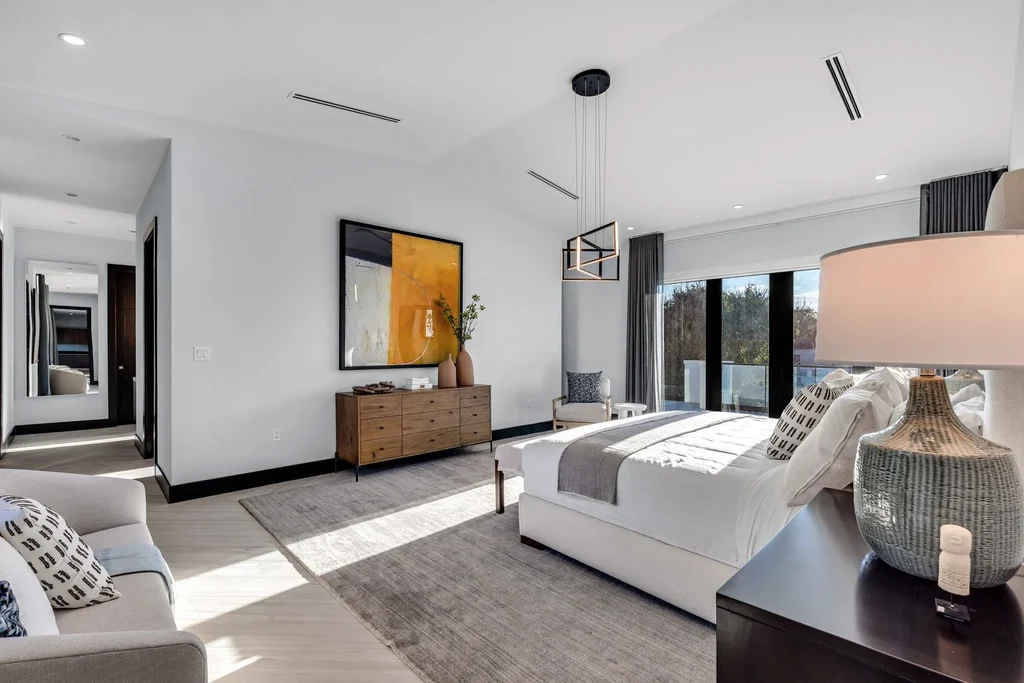 Infinity-edge pool and backyard oasis with canal views at 4424 Granada Blvd Coral Gables home for sale