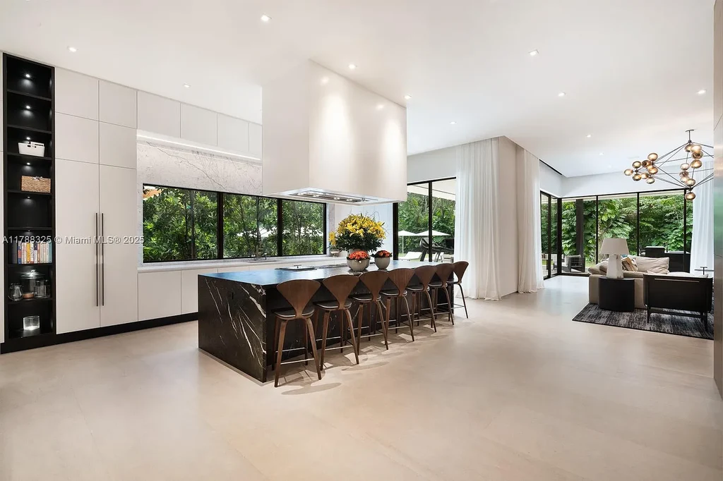 Luxury pool area surrounded by lush landscaping at 5400 Hammock Dr in Coral Gables Real Estate.