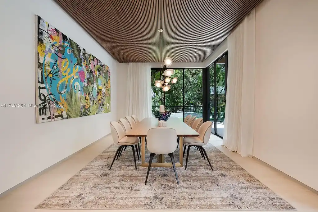 Luxury pool area surrounded by lush landscaping at 5400 Hammock Dr in Coral Gables Real Estate.