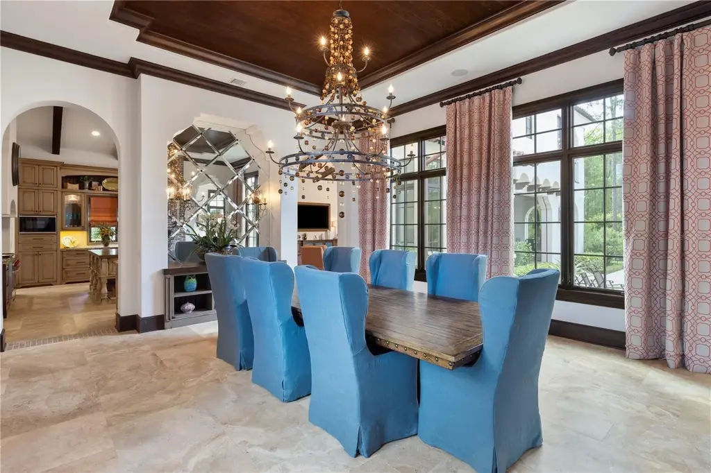 Front view of 10138 Enchanted Oak Dr showcasing Mediterranean architecture and lush landscaping in Orlando Real Estate.