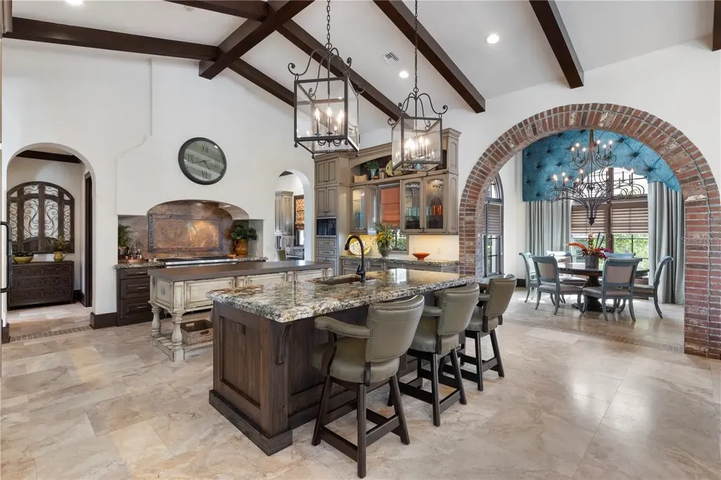 Front view of 10138 Enchanted Oak Dr showcasing Mediterranean architecture and lush landscaping in Orlando Real Estate.