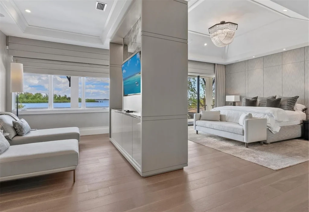 Balinese-inspired luxury waterfront estate at 3799 Flamingo Ave, Sarasota featuring infinity pool, koi pond, and tropical modern design
