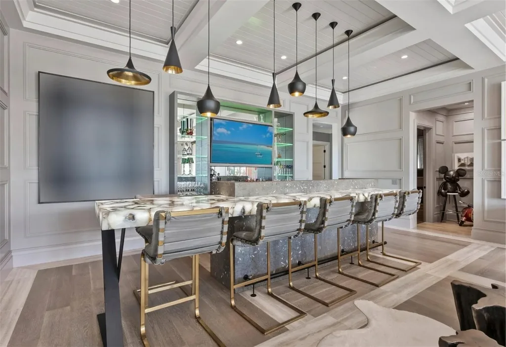 Balinese-inspired luxury waterfront estate at 3799 Flamingo Ave, Sarasota featuring infinity pool, koi pond, and tropical modern design