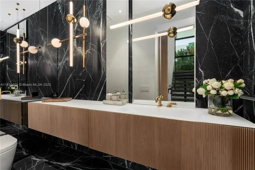 Breathtaking $20 Million Waterfront Masterpiece Redefines Miami Beach Real Estate Luxury 10 Custom Italian kitchen with Wolf appliances in Miami Beach home for sale