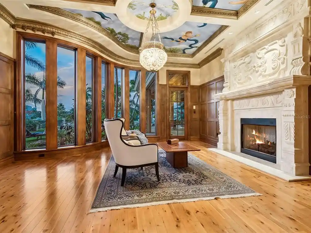 Interior living room of 1423 & 1435 Hillview Ave featuring coffered ceilings and stone fireplace