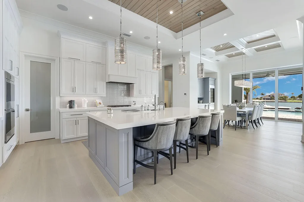 Front view of 1761 Ludlow Rd showcasing modern coastal architecture and lush landscaping in Marco Island.