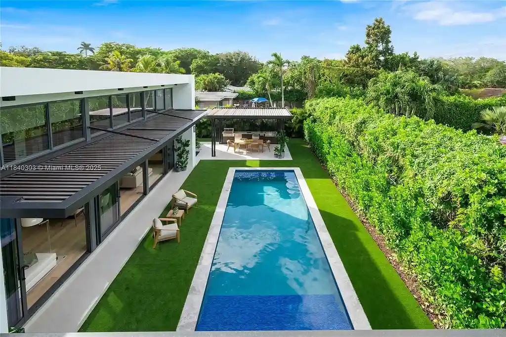 967 NE 117th St Listed for 5.7M Turnkey Tropical Modern Estate with Rooftop Pool and Privacy in Biscayne Park 13