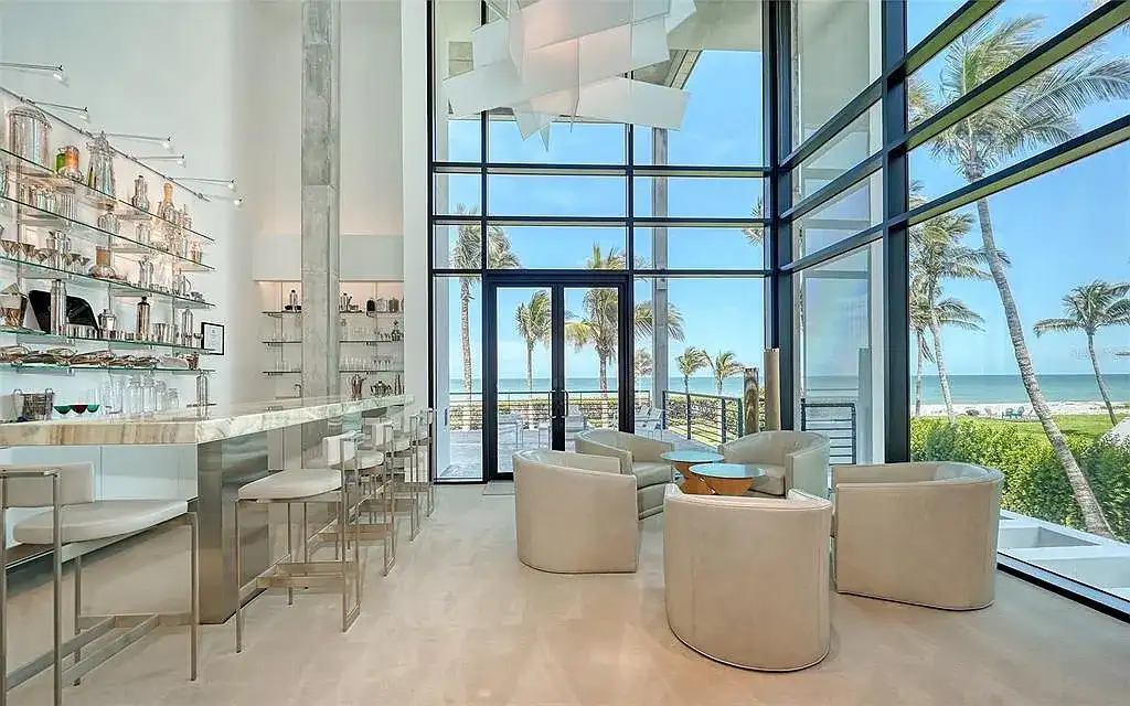 Gulf-front luxury home at 8250 Sanderling Rd in Sarasota, award-winning modern architecture with beach and lagoon frontage.
